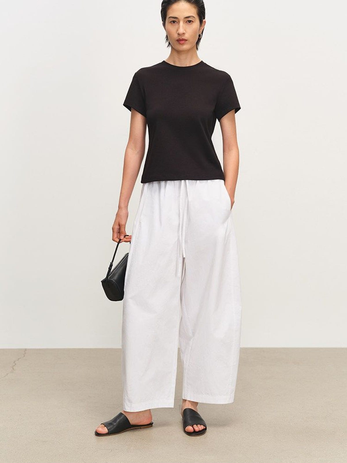 MSBEAST Paper Texture Cotton Balloon Pants in White - On Female Model