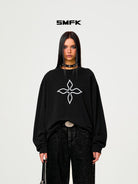 SMFK Cross Print Cotton Sweatshirt in Black - On Female Model