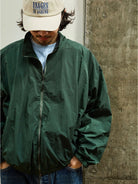 USAGE Lightweight Nylon Zip Up Jacket in Green - On Male Model