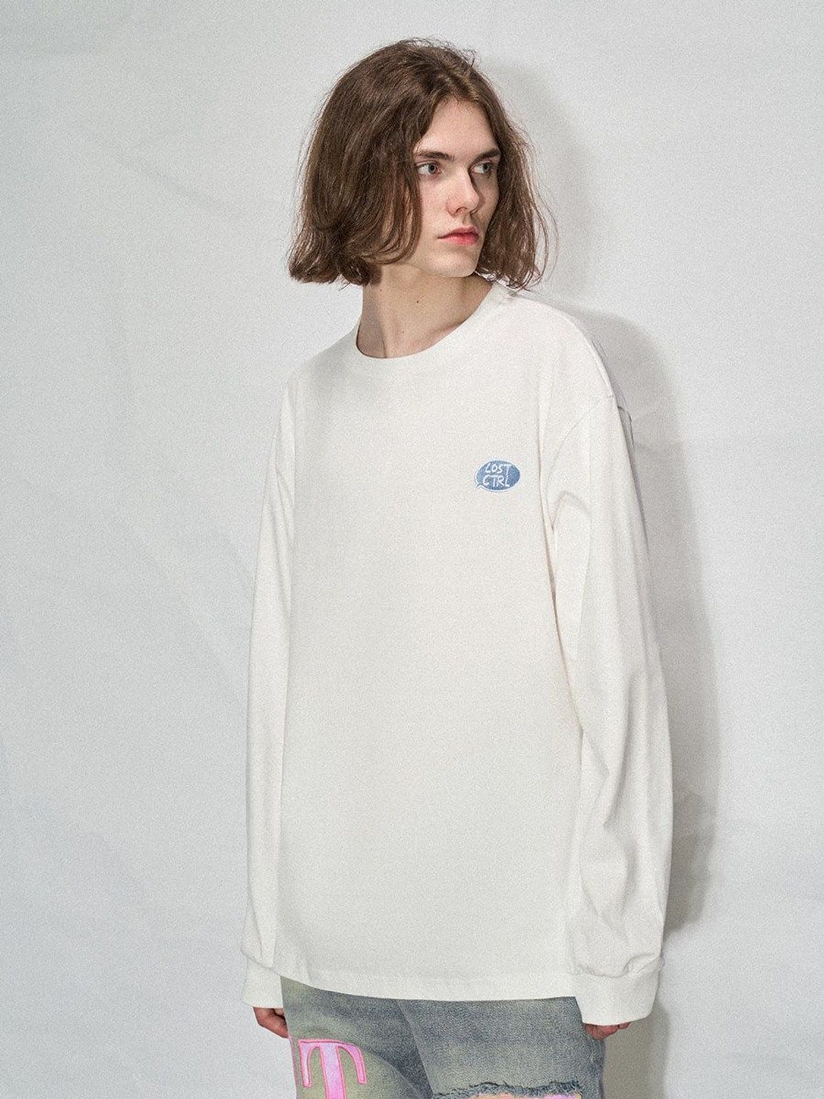 LOSTCTRL Embroidered Long Sleeve Cotton T Shirt in White - On Male Model