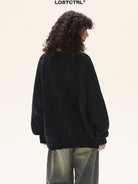 LOSTCTRL Cotton Blend Logo Knit Sweater in Black - On Model