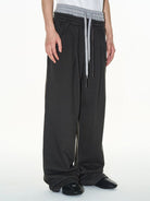 BLINDNOPLAN Double Waistband Pleated Sweatpants in Dark Gray - On Male Model