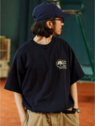 USAGE Retro Tennis Graphic Cotton T Shirt in Navy Blue - On Male Model