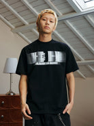 MEDM Glitch Logo Graphic Cotton T Shirt in Black - On Male Model
