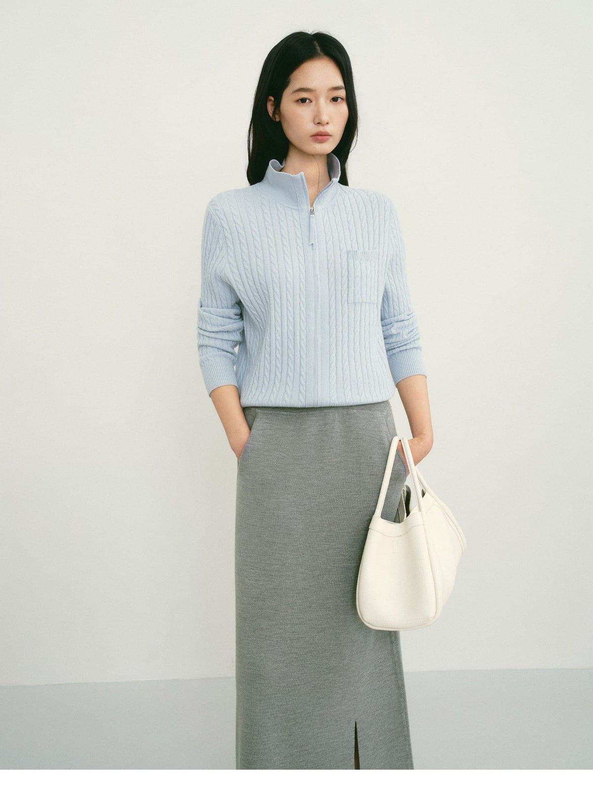 TEASEL Wool Cable Knit Zip Cardigan in Sky Blue - On Female Model