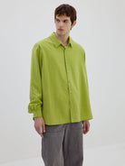 SIMPLE PROJECT Washed Lyocell Long Sleeve Shirt in Green - On Male Model