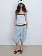 RARELY ALIKE Cropped Cotton Lantern Cargo Shorts in Sky Blue - On Female Model