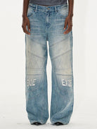 BLINDNOPLAN Paneled Embroidered Distressed Denim Pants in Blue - On Model