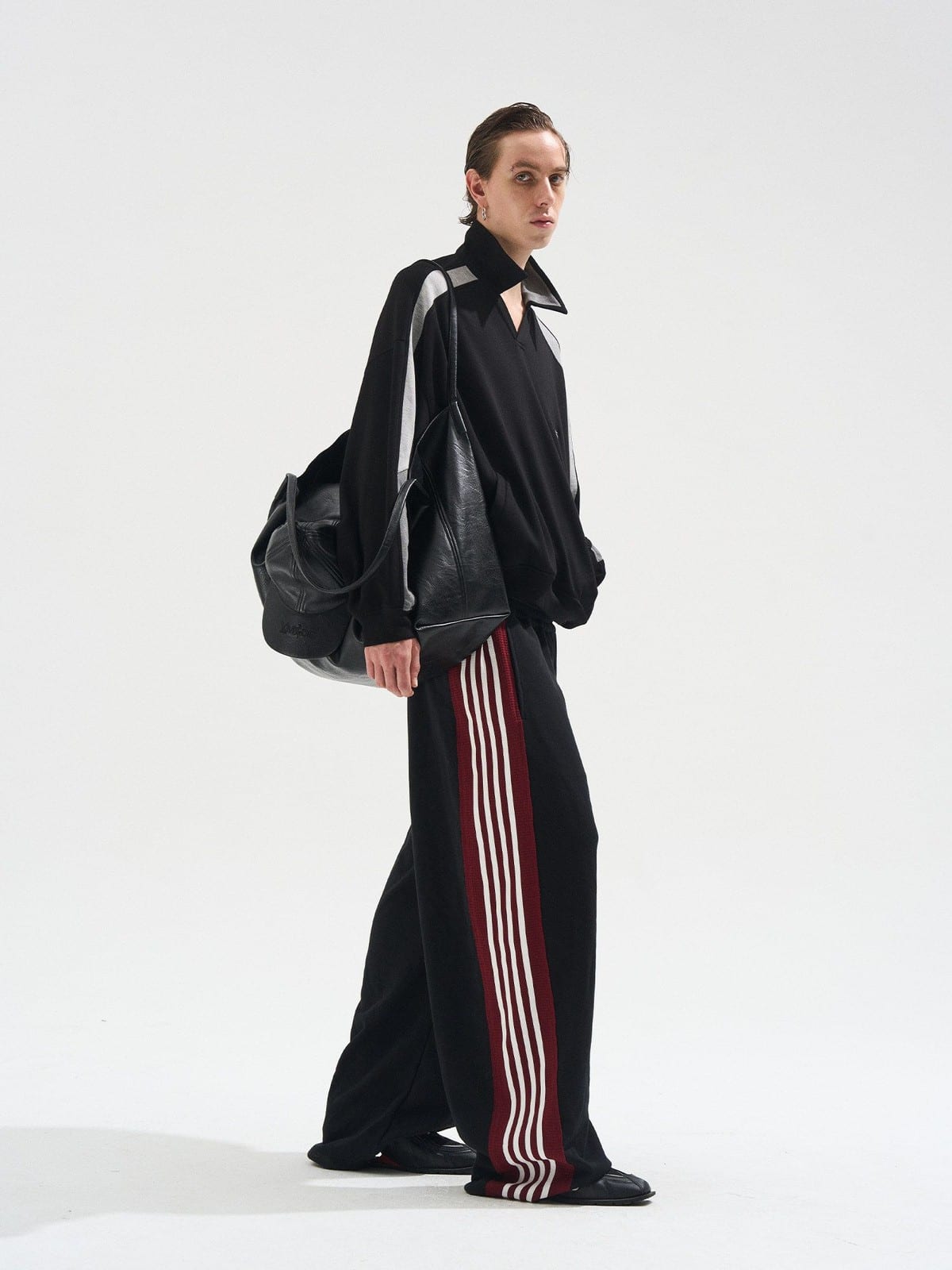 BLINDNOPLAN Raw Edge Contrast Paneled Sweatpants in Black - On Male Model