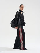 BLINDNOPLAN Raw Edge Contrast Paneled Sweatpants in Black - On Male Model