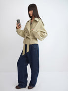 RARELY ALIKE Belted Cropped Trench Jacket in Beige - On Female Model