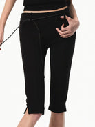 RARELY ALIKE Viscose Blend Belted Cropped Pants in Black - On Female Model