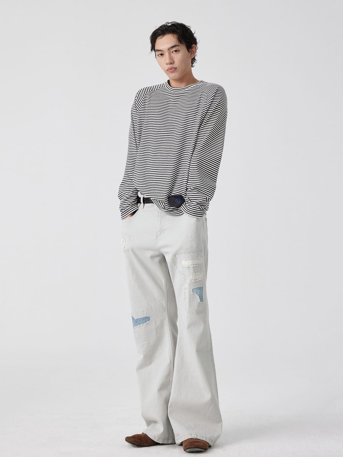 SIMPLE PROJECT Patchwork Distressed Flared Jeans in White - On Male Model