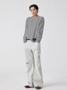 SIMPLE PROJECT Patchwork Distressed Flared Jeans in White - On Male Model