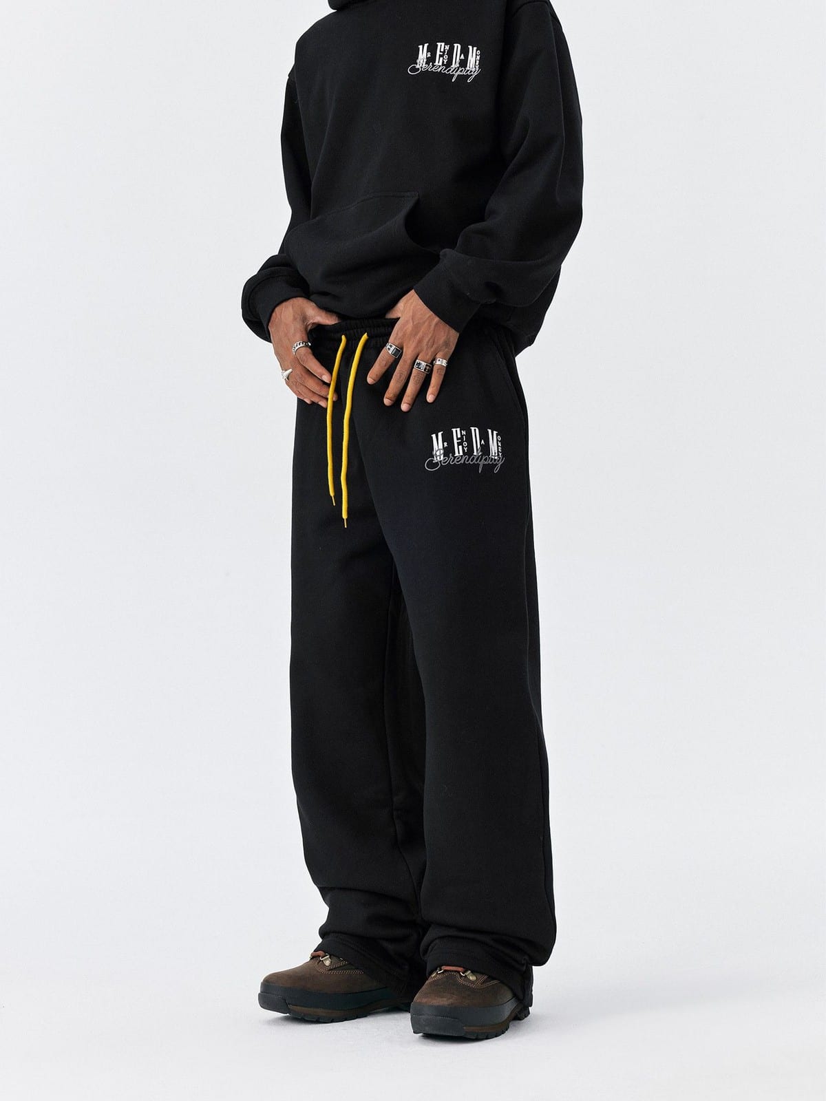 MEDM Fleece Lined Embroidered Sweatpants in Black - On Model