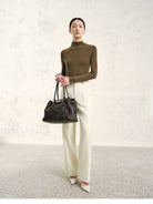 TEASEL Textured Wool Pleated Trousers in Cream - On Female Model
