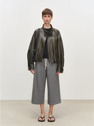 MSBEAST Oil Waxed Sheepskin Stand Collar Jacket in Olive - On Female Model