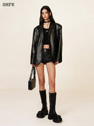 SMFK Glossy Waxed Denim Micro Shorts in Black - On Female Model