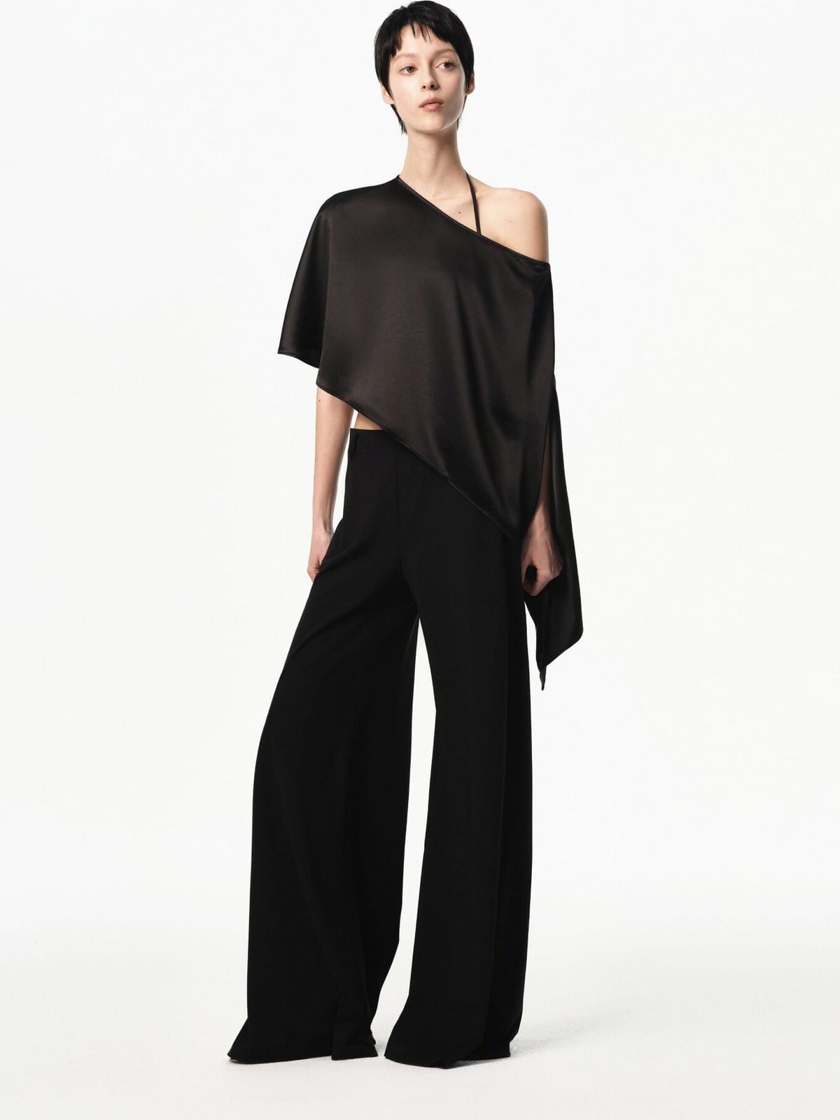 RARELY ALIKE Asymmetrical Satin One Shoulder Blouse in Black - On Female Model