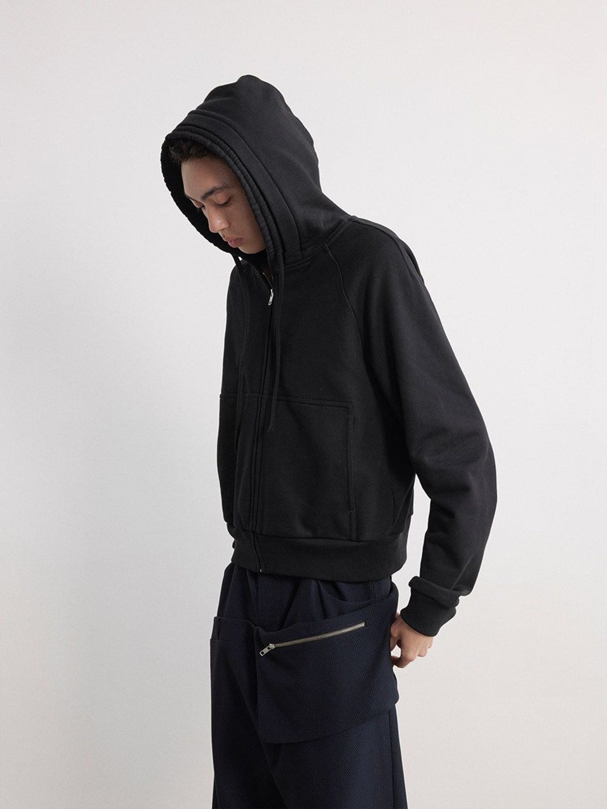 JCAESAR STUDIO Cotton Raglan Zip Up Hoodie in Black - On Male Model