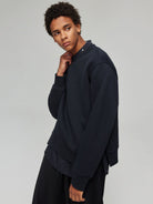 SIMPLE PROJECT Spacer Fabric Slit Hem Sweatshirt in Navy Blue - On Male Model