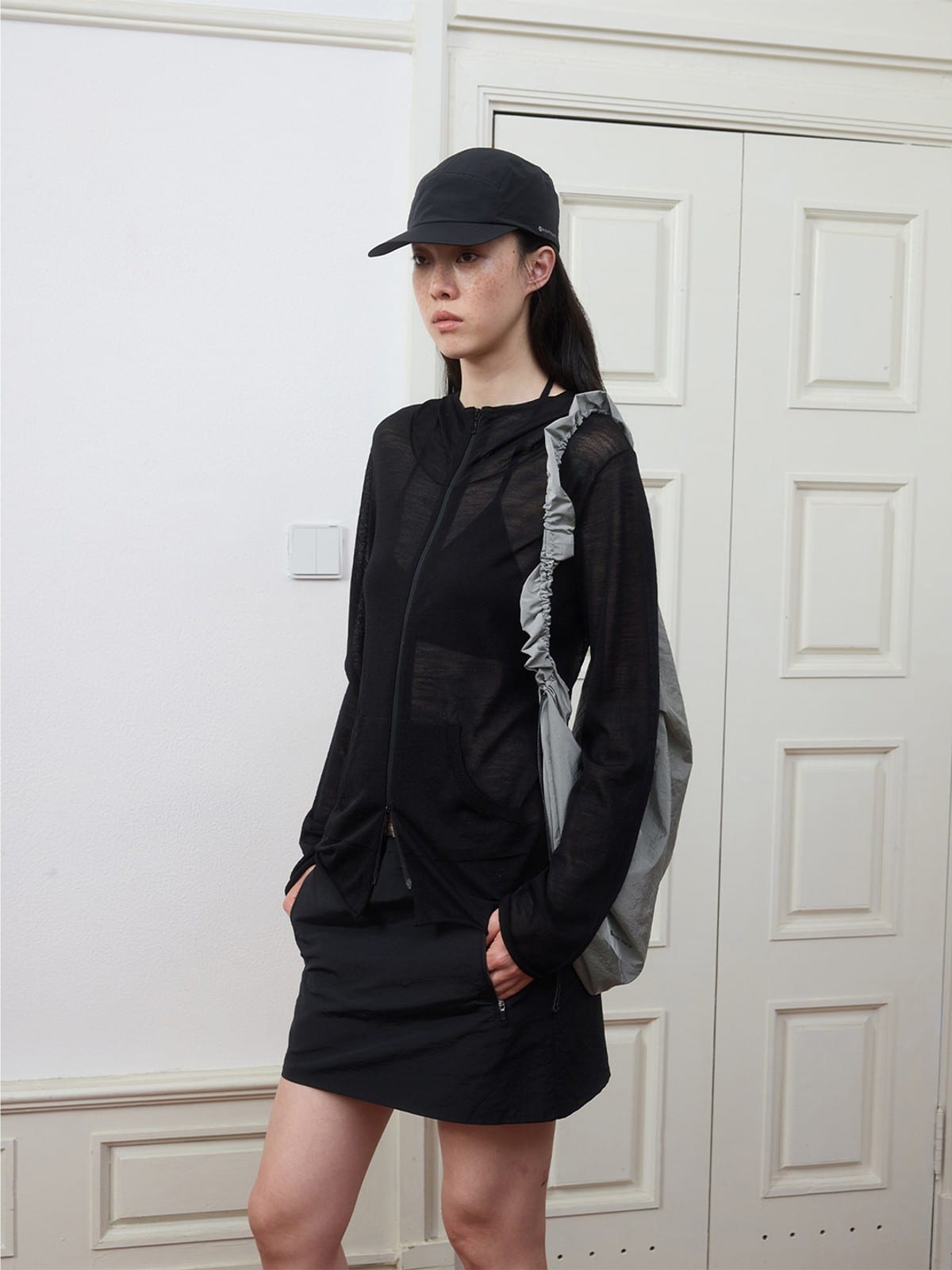 Random Piece Lightweight Merino Hooded Zip Cardigan in Black - On Female Model