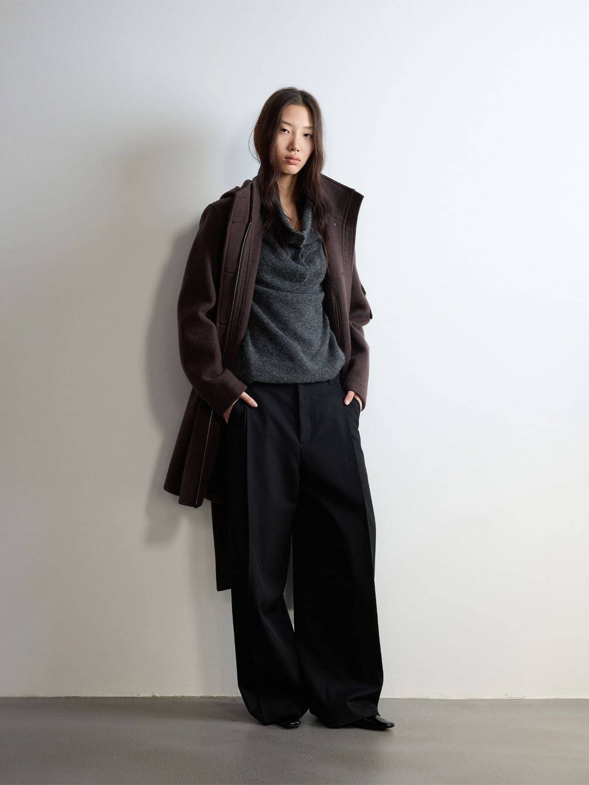 Random Piece Pleated Merino Wool Wide Leg Trousers in Black - On Female Model