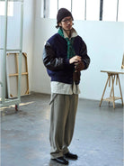 USAGE Reversible Velvet Leather Varsity Jacket in Navy Blue - On Male Model