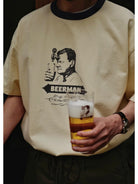 USAGE Graphic Cotton Ringer T Shirt in Cream - On Male Model