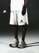 LOSTCTRL Distressed Structural Print Shorts in White - On Male Model
