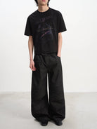 JCAESAR STUDIO Textured Baguette Print T Shirt in Black - On Male Model