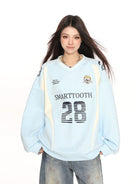 Big Gold studio V Neck Graphic Jersey Sweatshirt in Sky Blue - On Female Model