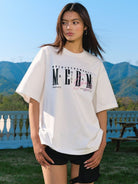 MEDM Vintage Logo Typography Cotton T Shirt in White - On Female Model