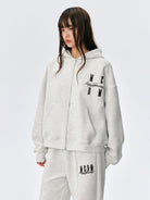 MEDM Embroidered Cotton Blend Zip Up Hoodie in Beige - On Female Model