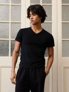 Retro 21 Anti Wrinkle V Neck T Shirt in Black - On Male Model