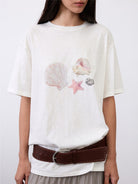 Random Piece Shell Print Cotton Lyocell T Shirt in Cream - On Female Model