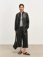 MSBEAST Sheepskin Leather Bomber Jacket in Black - On Female Model