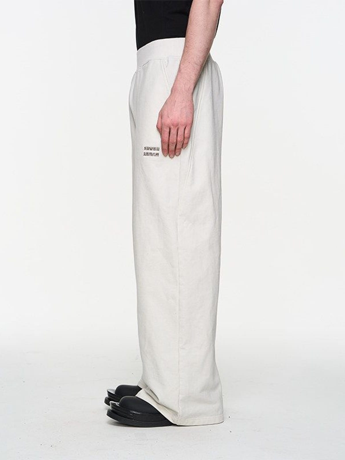 BLINDNOPLAN Foil Logo Cotton Sweatpants in White - On Male Model