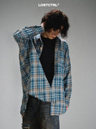 LOSTCTRL Frayed Asymmetric Plaid Shirt in Blue - On Male Model