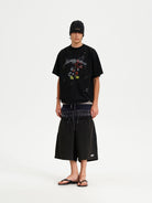 MASONPRINCE Reversible Parody Graphic Cotton T Shirt in Black - On Male Model