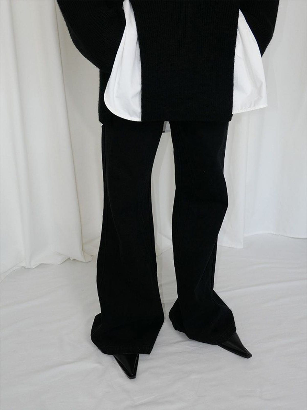 RARELY ALIKE Curved Seam Denim Flare Jeans in Black - On Model
