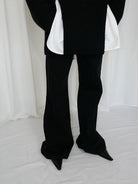 RARELY ALIKE Curved Seam Denim Flare Jeans in Black - On Model