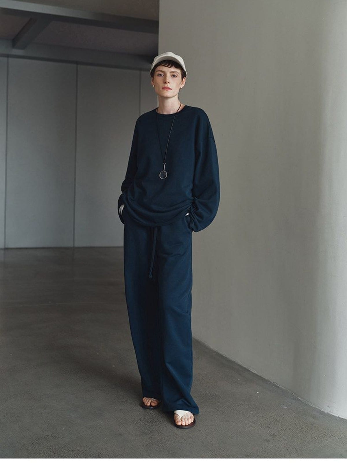 MSBEAST Cotton Terry Sweatshirt Tapered Joggers in Navy Blue - On Female Model