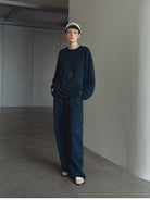 MSBEAST Cotton Terry Sweatshirt Tapered Joggers in Navy Blue - On Female Model