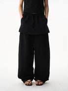 BLINDNOPLAN Layered Cotton Blend Sweatpants in Black - On Model