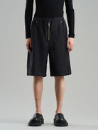 BLINDNOPLAN Textured Rivet Suit Shorts in Black - On Male Model