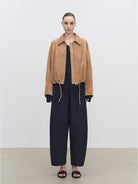 MSBEAST Cropped Leather Drawstring Jacket in Beige - On Female Model
