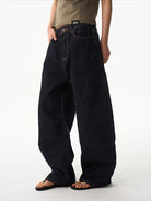BLINDNOPLAN Curved Wide Leg Raw Denim Jeans in Denim - On Model
