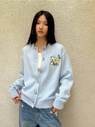 MEDM Floral Embroidered Knit Cardigan in Sky Blue - On Female Model