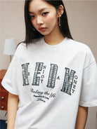 MEDM Pearl Embellished Letter Cotton T Shirt in White - On Female Model